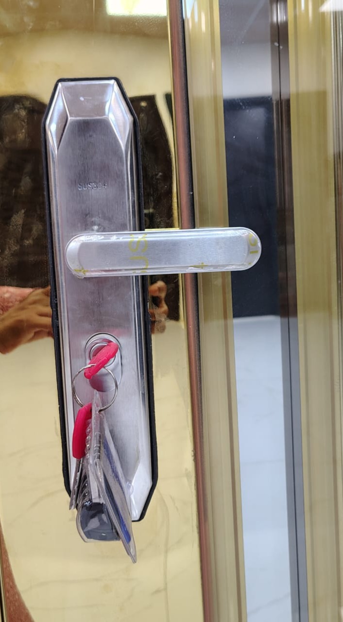 Thumbnail image of grey door with some red leaves around, front view